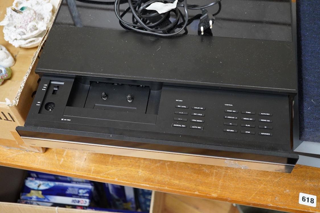 A Bang and Olufsen 6500 hi-fi system, comprising of a Beocord 6500, a Beogram CD 6500, a Beomaster 6500, and a master control panel, together with a pair of floor standing pedestal speakers, 164cm high, and pair of type